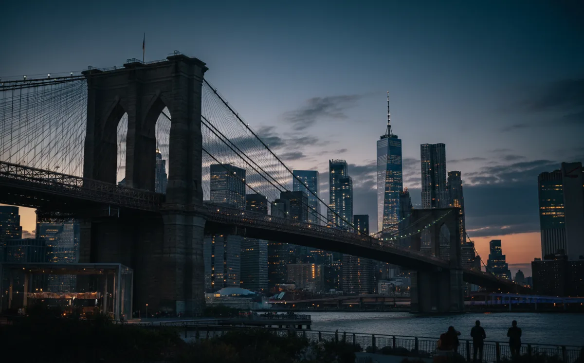 The Brooklyn Bridge and Lower Manhattan skyline at dusk from Brooklyn Bridge Park.